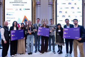 Judges pose with youth whose business ideas won top recognition at the 2024 NFTE World Youth Entrepreneurship Challenge. The students were awarded cash prizes to grow their businesses or further their educational goals. Photo by Alyssa Ringler. nfte.com.